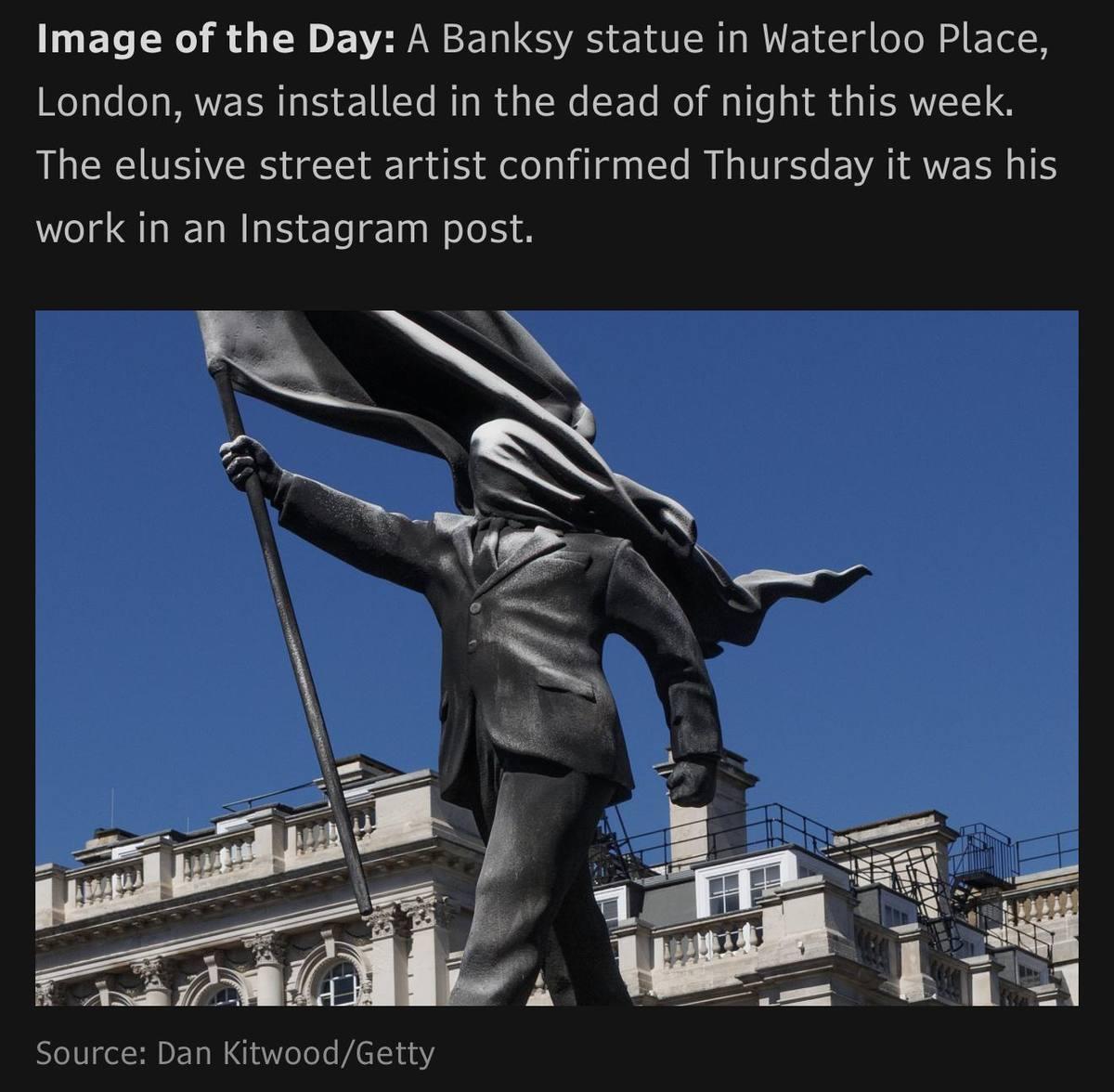 Banksy statue Waterloo Place London headless figure with flag